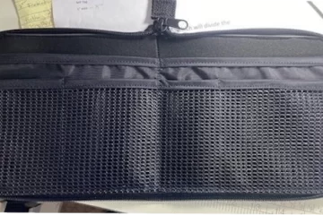 Zippered pouch with a flat-opening design and multiple compartments